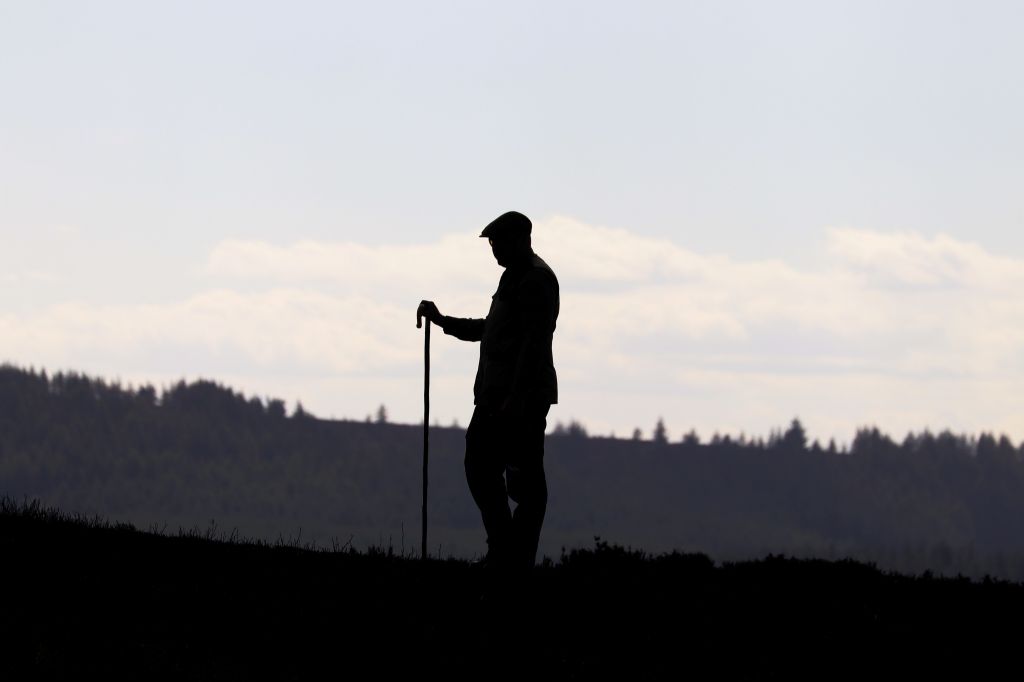 Silhouette of man standing on a hunting trip